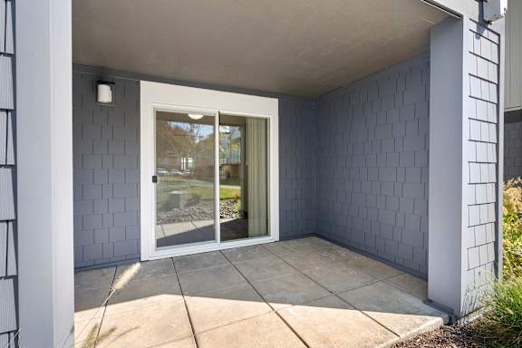 the front porch of a home with a glass door