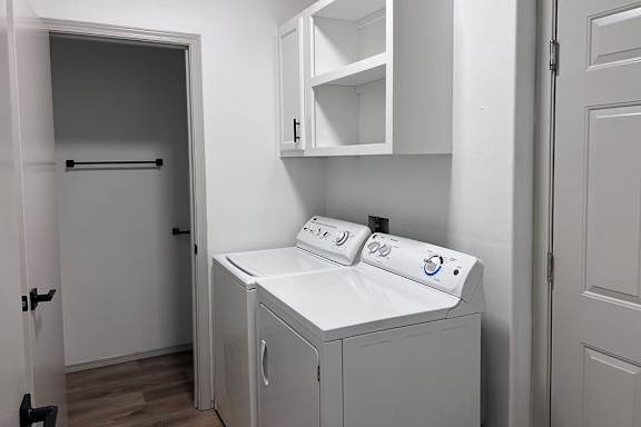 A small laundry room with a washer and dryer. at Madison Sierra Sun, Washington