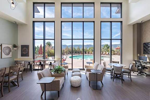 Clubhouse with view out of huge wall of windows at Vistas at Jackson Creek, Monument, CO