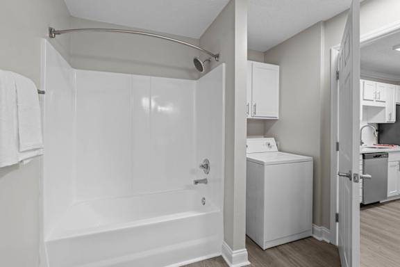 A white bathroom with a walk-in shower and a white toilet.
