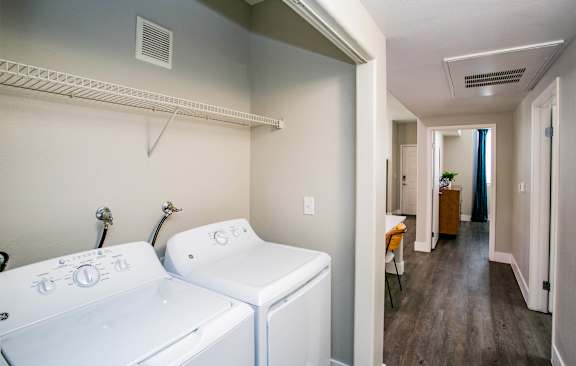 A laundry room with a washer and dryer. at Octave Apartments, Nevada, 89123