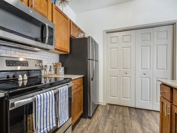a kitchen with a stove microwave and refrigerator