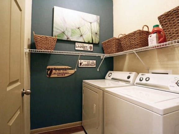 a small laundry room with a washer and a dryer