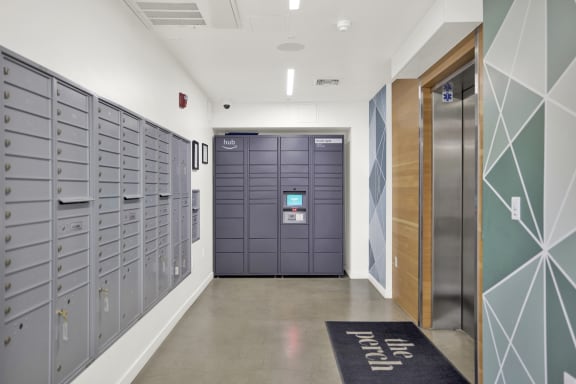 a long hallway with lockers and a door to a locker room at the perch, Los Angeles, CA 90065