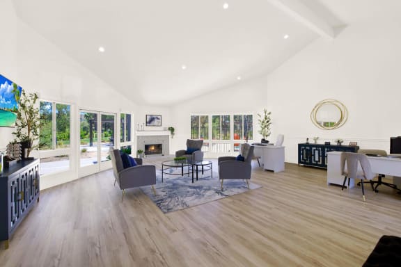 a living room with furniture and a fireplace at Monterra Ridge Apartments, Canyon Country