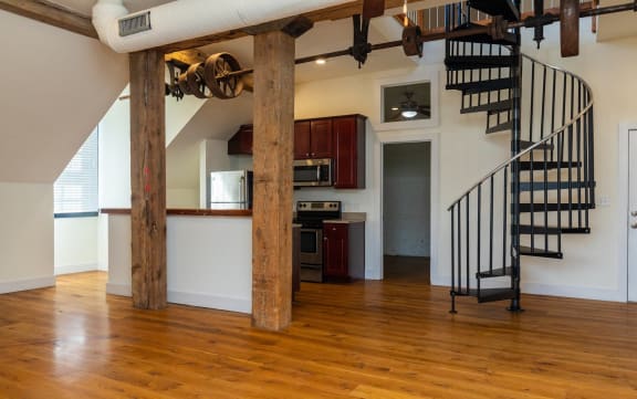 Floor Plan  a living room with a staircase and a kitchen in a house