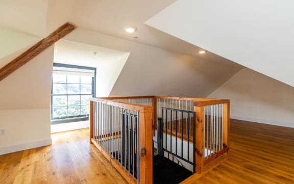 Floor Plan  a baby crib in the middle of a room with wood floors and a window
