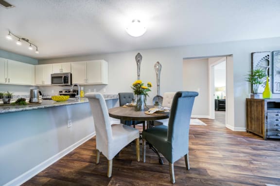 Dining area with ample room for seating adjacent to the open kitchen.