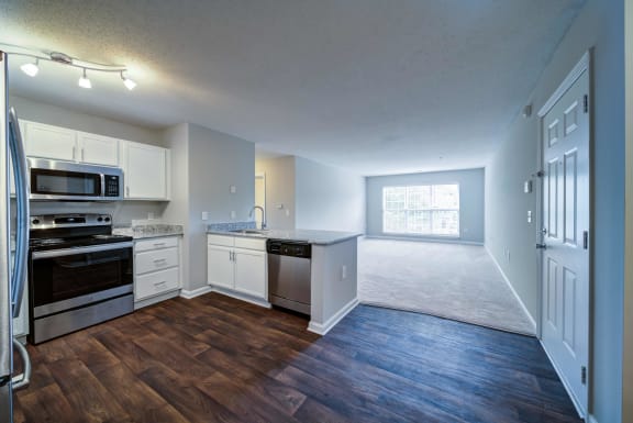 Kitchens and bathrooms feature faux wood flooring.