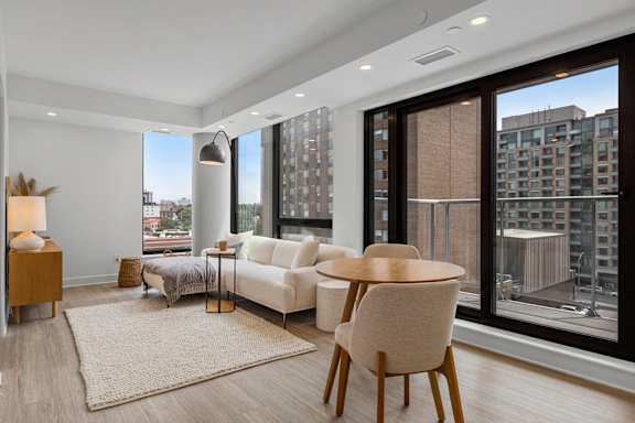 A modern living room with a view of the city.