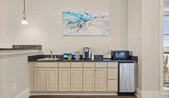 Kitchenette with sink microwave and mini fridge at Ansley Place Apartments, Houma, LA 70360