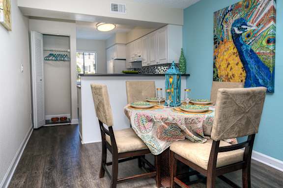 Dining area at Town Place Apartments featuring durable vinyl flooring throughout all wet areas and an offset layout connected to the kitchen for easy everyday dining.