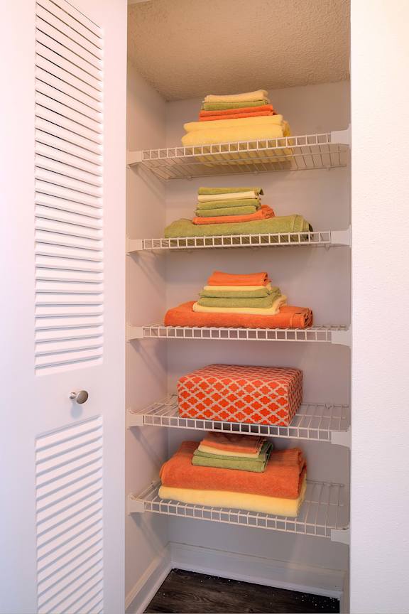 Hall closet at Town Place Apartments offering extra storage with built-in shelving for everyday organization.