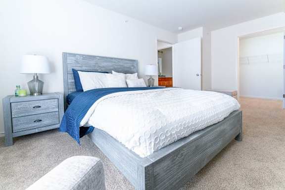a bedroom with a bed and two night stands