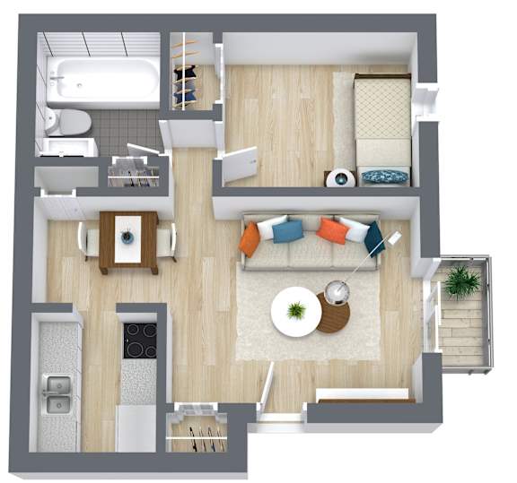 A top-down view of a living room with a couch, coffee table, and kitchen area.