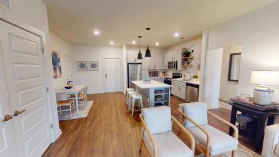 a kitchen and dining area in a 555 waverly unit
