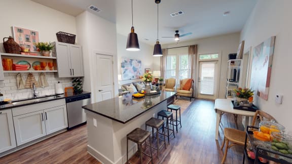 an open floor plan with a kitchen and living room