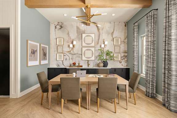 A dining room with a table set for six.