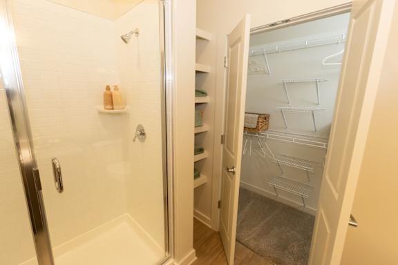 A white fridge with a door open in a room.