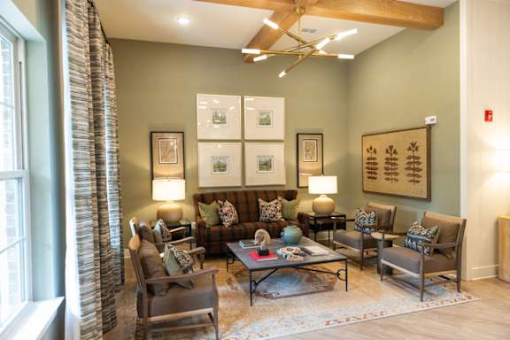A living room with a large couch and a coffee table.