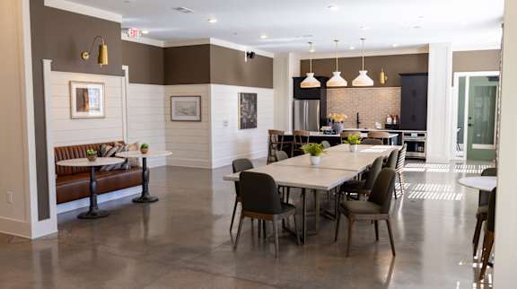 A modern dining room with a table set for six.