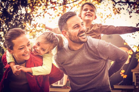 Happy Family in Autumn at Brookwood at Islip, New York, 11751