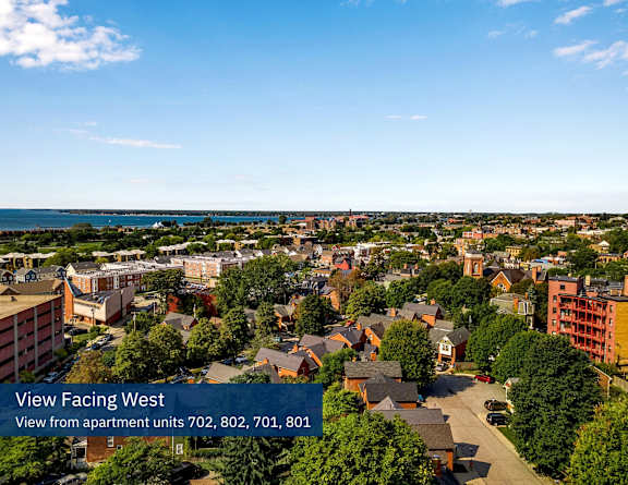 an aerial view of a neighborhood with a view of the ocean