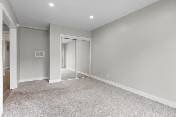a renovated living room with grey walls and carpet at Parkview Terrace Apartments, Sherman Oaks, CA, 91423