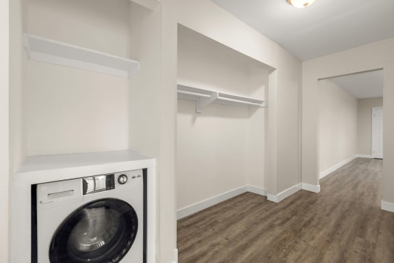 a laundry room with a washer and dryer in it
