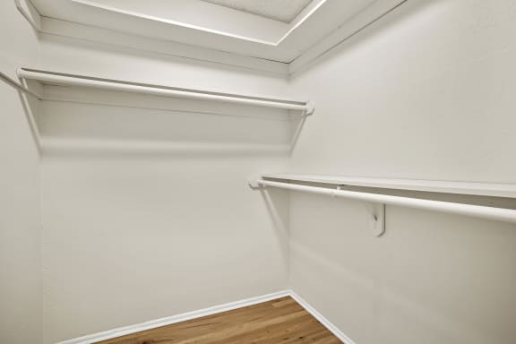 the preserve at ballantyne commons apartment closet with white walls and wood flooring
