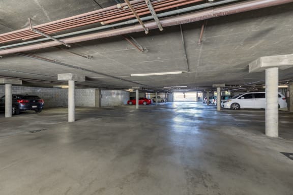 a parking garage with cars in it