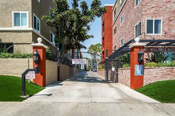 A gated entrance to a building with a sign that says "CAN'T ENTER".