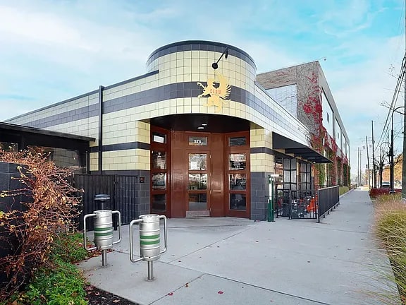 Griffin Claw with a curved facade and a large mural at Eton Square Apartments and Townhomes, Michigan, 48009