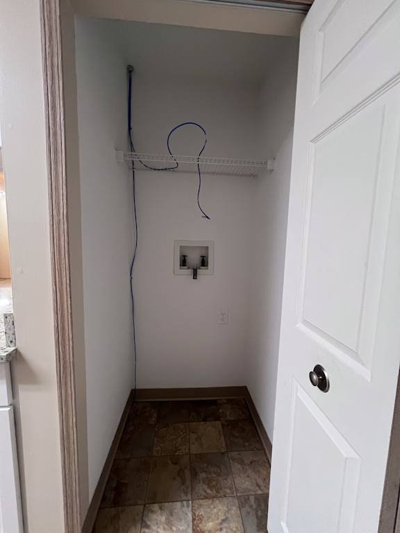 A white door is closed with a black handle.