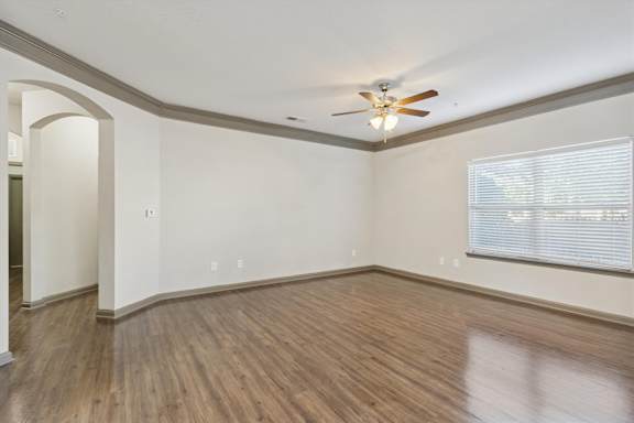 Spacious Living Area With Wood-Style Flooring