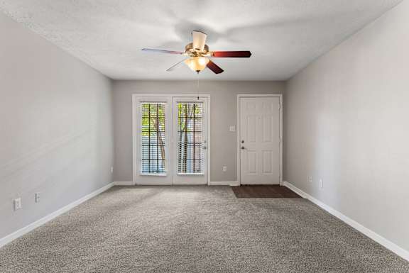 Spacious Living Area with Carpet