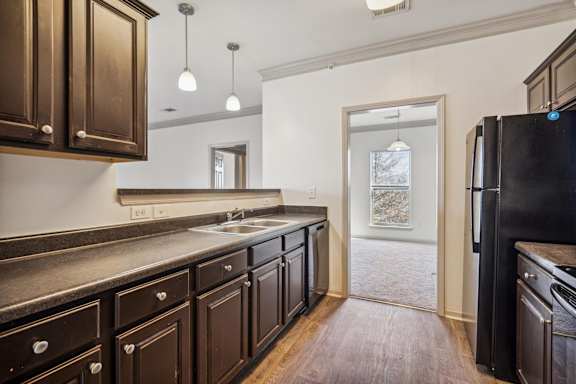 Kitchen with Dark Brown Cabinetry and Stainless Steel Appliances