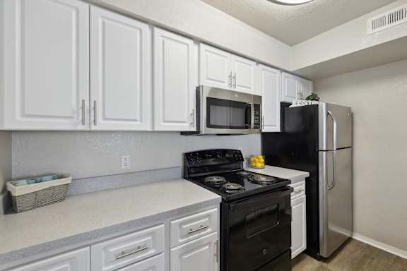 Kitchen with White Cabinetry and Stainless Steel Appliances