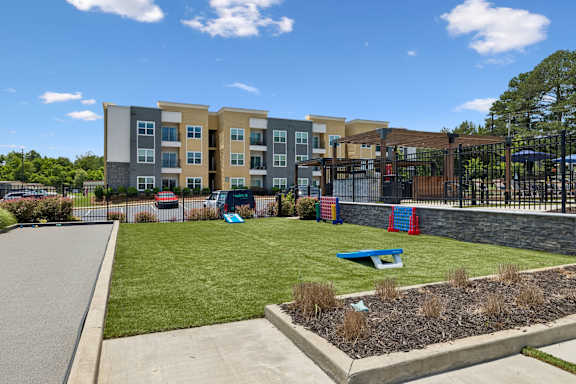 Patio area with cornhole