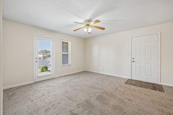 Spacious Living Area with Carpet
