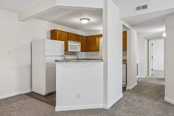 Kitchen with Counter Seating Overhang
