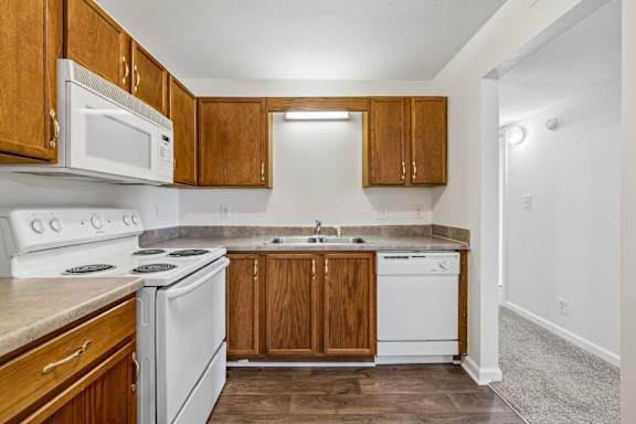 Fully-Equipped Kitchen with White Appliances
