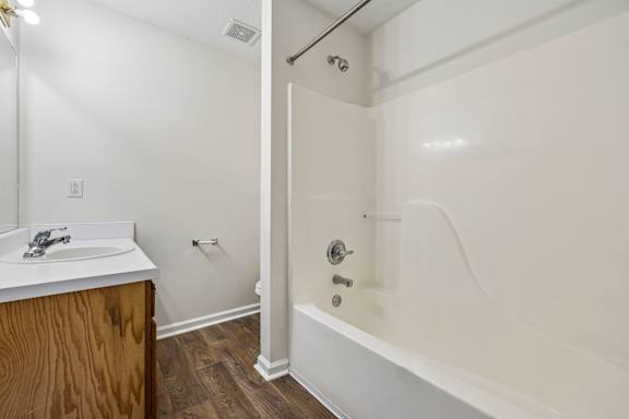 Bedroom with Wood-style flooring