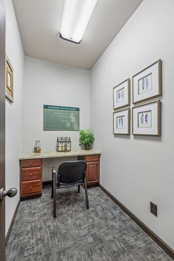 A small office with a desk and chair.
