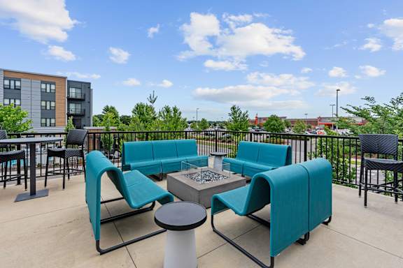 A patio with a table and chairs.