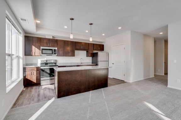 Open Concept Kitchen With Stainless Steel Appliances & Large Island
