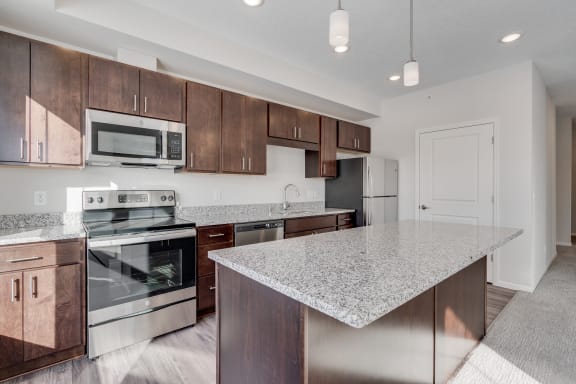 Fully-Equipped Kitchen With Granite Counters & Stainless Steel Appliances