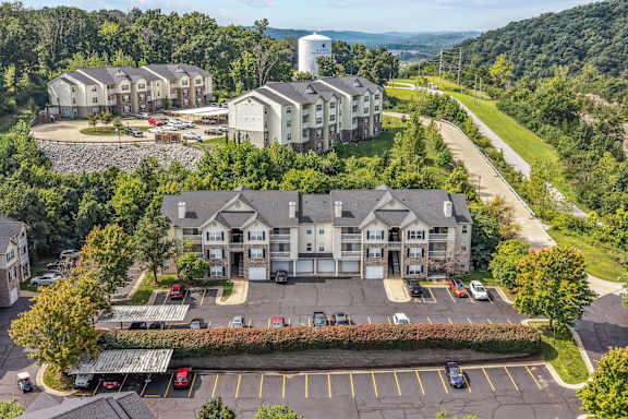 A large building with a parking lot in front of it.