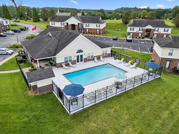 A large house with a pool in the backyard.