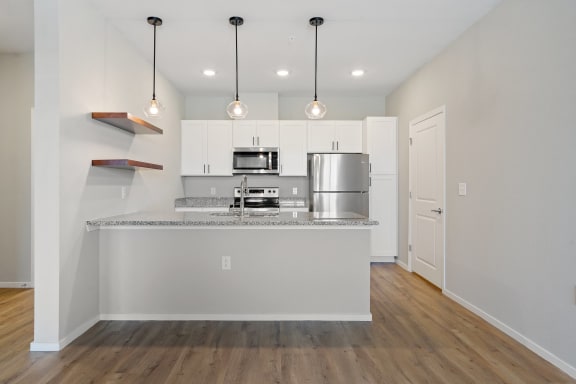 Kitchen with White Cabinetry and Stainless Steel Appliances
